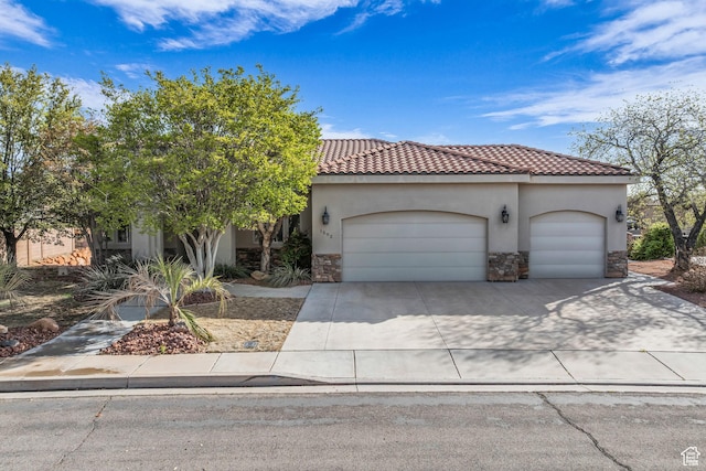 1592 N Parkstone Rd, Washington, UT 84780 - view of front of home with concrete driveway, stucco siding, stone siding, an attached garage, and a tiled roof