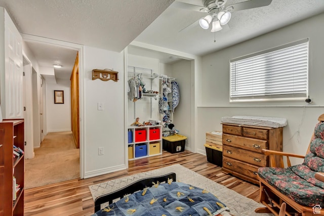 1224 S 760 W, Provo, UT 84601 - bedroom with a textured ceiling, a closet, a ceiling fan, wood finished floors, and baseboards