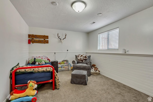 1224 S 760 W, Provo, UT 84601 - carpeted bedroom with visible vents, a wainscoted wall, and a textured ceiling