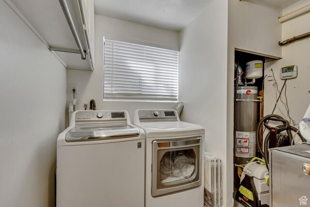 1224 S 760 W, Provo, UT 84601 - clothes washing area with cabinet space, washer and clothes dryer, and water heater