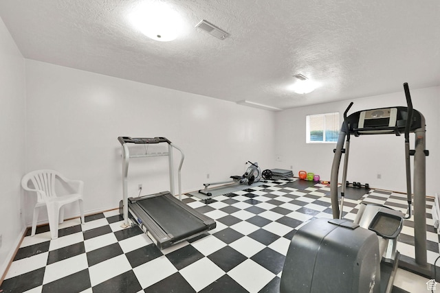992 E 5625 S, South Ogden, UT 84405 - exercise area with visible vents, tile patterned floors, baseboards, and a textured ceiling