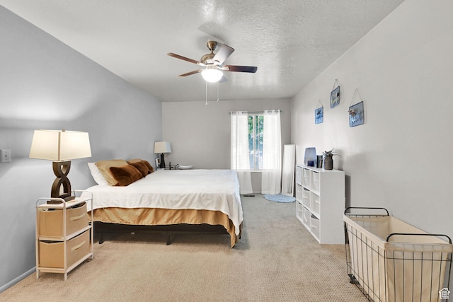 992 E 5625 S, South Ogden, UT 84405 - bedroom featuring ceiling fan, light colored carpet, baseboards, and a textured ceiling