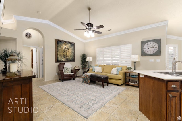 145 S Crystal Lakes Dr Unit 80, St George, UT 84770 - living room featuring ceiling fan, lofted ceiling, crown molding, and arched walkways