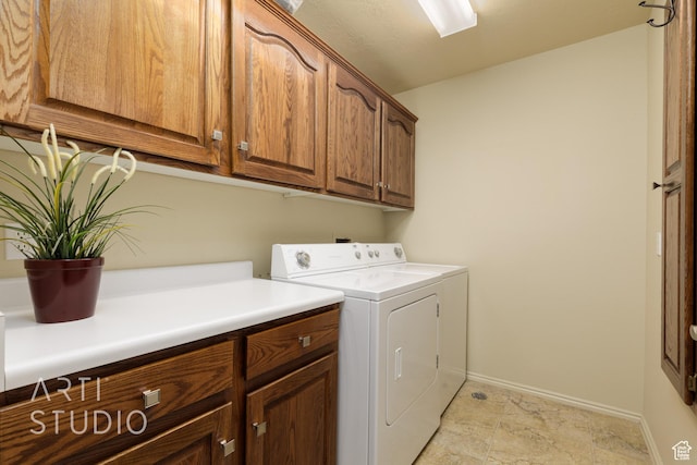 145 S Crystal Lakes Dr Unit 80, St George, UT 84770 - laundry room featuring independent washer and dryer, baseboards, and cabinet space
