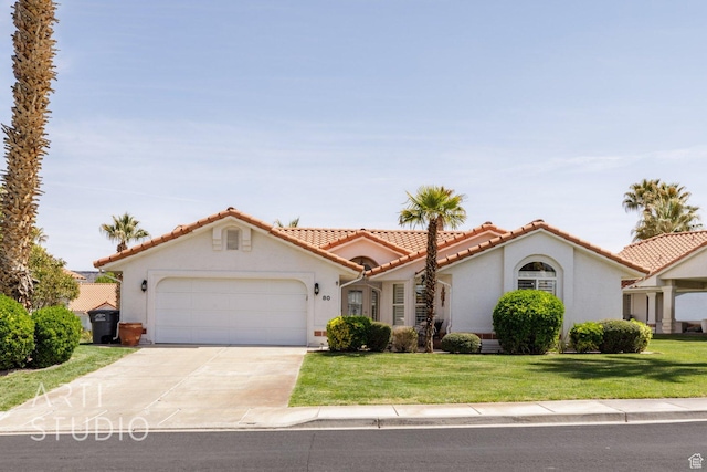 145 S Crystal Lakes Dr Unit 80, St George, UT 84770 - mediterranean / spanish-style house with a tile roof, a garage, stucco siding, driveway, and a front yard
