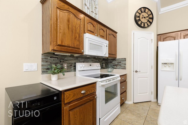 145 S Crystal Lakes Dr Unit 80, St George, UT 84770 - kitchen featuring white appliances, decorative backsplash, light countertops, and light tile patterned floors