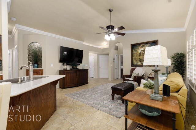 145 S Crystal Lakes Dr Unit 80, St George, UT 84770 - living room featuring ceiling fan, ornamental molding, vaulted ceiling, and arched walkways