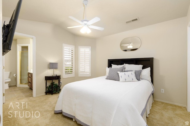 145 S Crystal Lakes Dr Unit 80, St George, UT 84770 - bedroom with light colored carpet, lofted ceiling, ensuite bathroom, and a ceiling fan