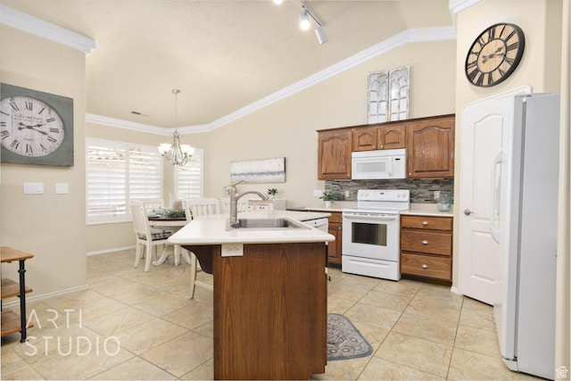 145 S Crystal Lakes Dr Unit 80, St George, UT 84770 - kitchen with white appliances, lofted ceiling, light countertops, a center island with sink, and a chandelier