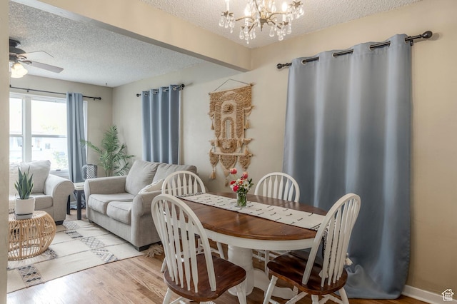 1240 E 520 S, Provo, UT 84606 - dining room with a chandelier, a textured ceiling, ceiling fan, and light wood-style floors