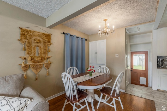 1240 E 520 S, Provo, UT 84606 - dining room with light wood-type flooring, a textured ceiling, baseboards, and a chandelier