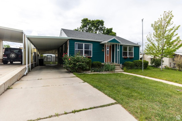 1240 E 520 S, Provo, UT 84606 - view of front of house featuring a front yard, a carport, concrete driveway, and a shingled roof