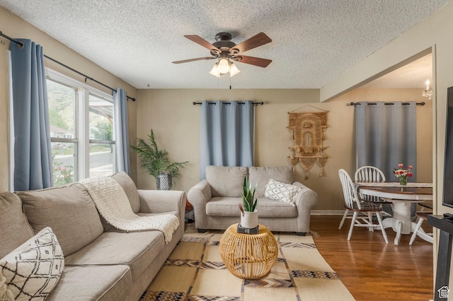1240 E 520 S, Provo, UT 84606 - living room with a textured ceiling, wood finished floors, a ceiling fan, and baseboards