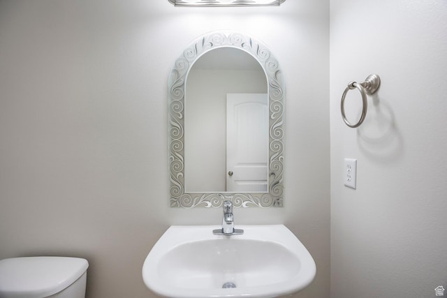bathroom with a sink and toilet