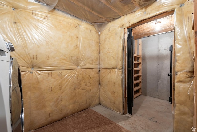 unfinished below grade area with washer / dryer