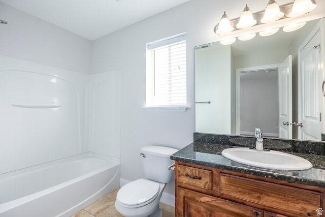 full bathroom featuring toilet, vanity, tile patterned flooring, baseboards, and shower / bath combination