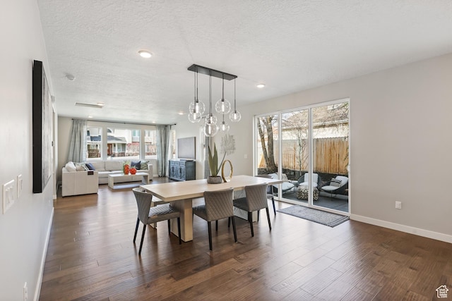 dining area with recessed lighting, a textured ceiling, baseboards, and dark wood finished floors