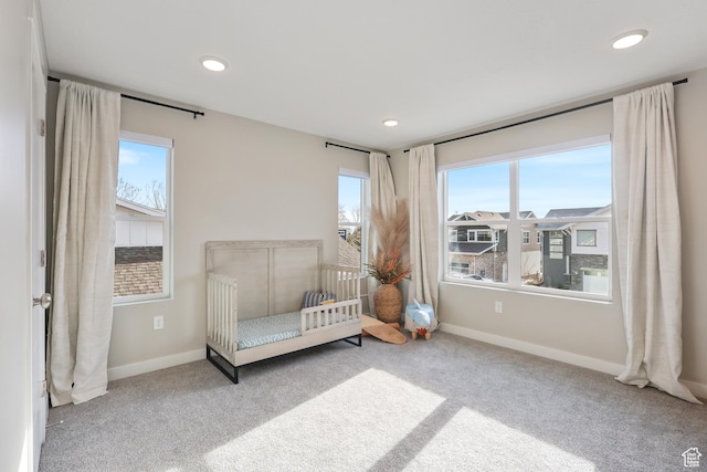 carpeted bedroom with baseboards and recessed lighting
