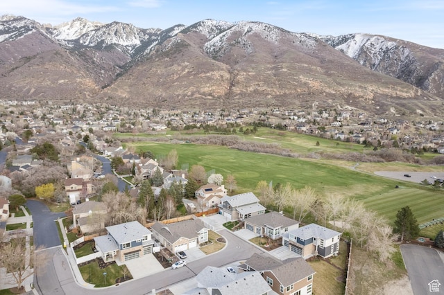 birds eye view of property featuring a mountain view, view of golf course, and a residential view