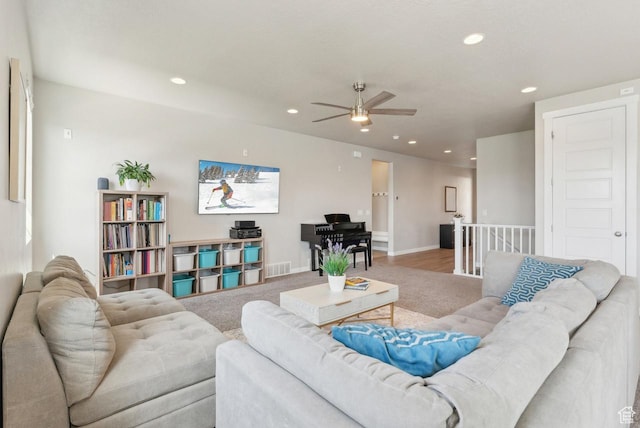 carpeted living room featuring recessed lighting, visible vents, baseboards, and ceiling fan