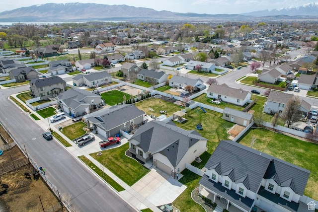 drone / aerial view with a mountain view and a residential view