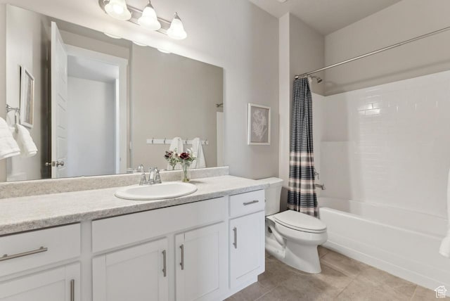 full bath featuring toilet, tile patterned floors, vanity, and shower / tub combo with curtain