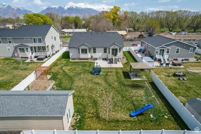 birds eye view of property with a mountain view and a residential view