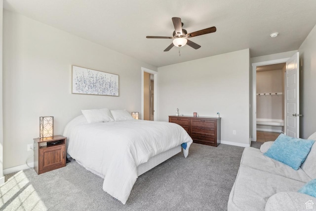 bedroom with baseboards, a ceiling fan, and carpet