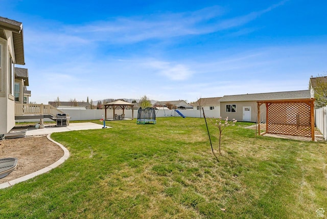 view of yard with a gazebo, a patio area, and a fenced backyard