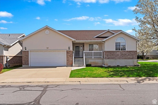 32 Belmore Dr, Kaysville, UT 84037 - single story home featuring covered porch, a front yard, brick siding, an attached garage, and concrete driveway