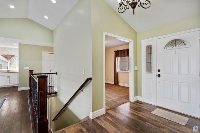 32 Belmore Dr, Kaysville, UT 84037 - foyer entrance with baseboards, high vaulted ceiling, a chandelier, and dark wood finished floors
