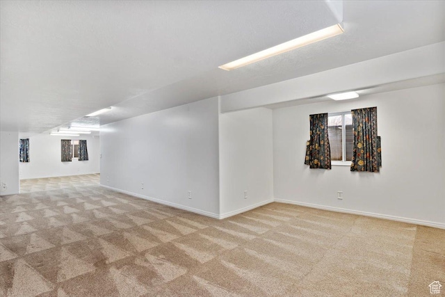32 Belmore Dr, Kaysville, UT 84037 - basement featuring baseboards, carpet flooring, and a textured ceiling