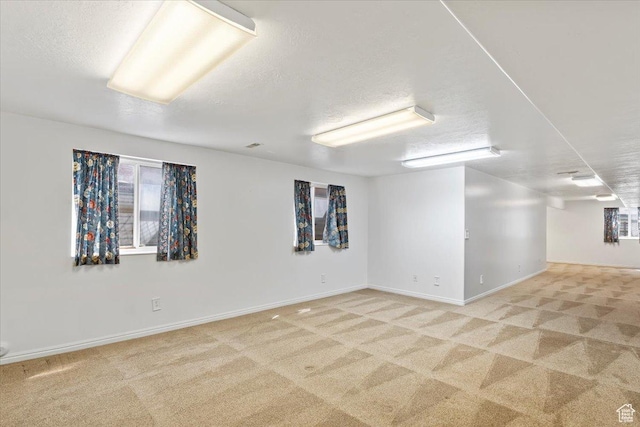 32 Belmore Dr, Kaysville, UT 84037 - basement with baseboards, light carpet, and a textured ceiling