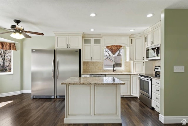 32 Belmore Dr, Kaysville, UT 84037 - kitchen featuring a sink, decorative backsplash, dark wood-type flooring, and stainless steel appliances