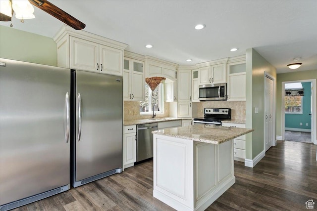 32 Belmore Dr, Kaysville, UT 84037 - kitchen featuring tasteful backsplash, plenty of natural light, and stainless steel appliances