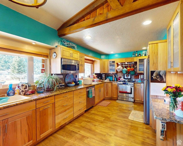 263 W 300 S, Parowan, UT 84761 - kitchen with stainless steel appliances, light wood-type flooring, glass insert cabinets, lofted ceiling, and a textured ceiling