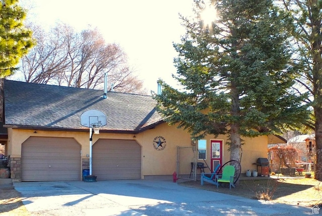 263 W 300 S, Parowan, UT 84761 - view of front of home with a garage, stucco siding, roof with shingles, and driveway
