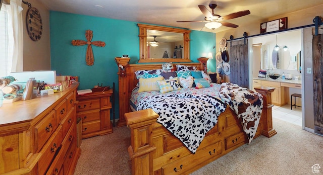 263 W 300 S, Parowan, UT 84761 - bedroom featuring ceiling fan, a barn door, and light carpet