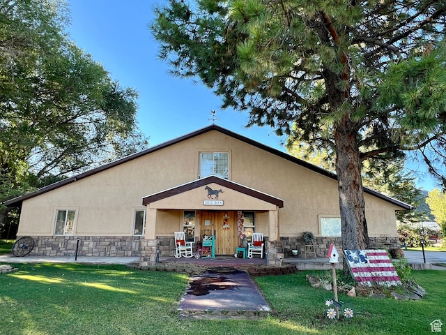 263 W 300 S, Parowan, UT 84761 - exterior space featuring a front yard, stucco siding, covered porch, and stone siding