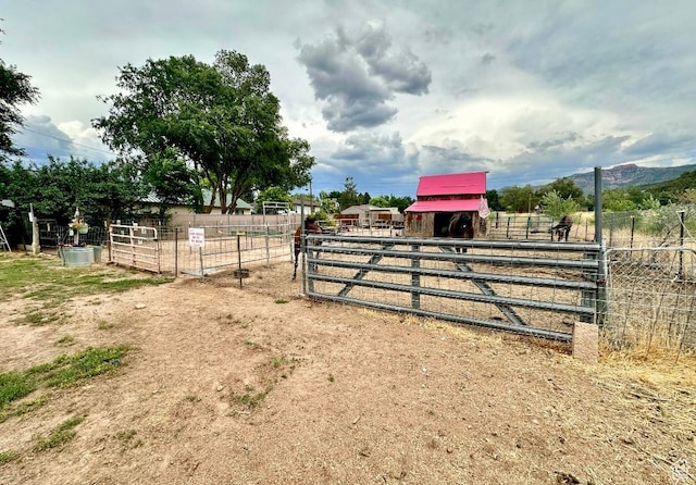 263 W 300 S, Parowan, UT 84761 - view of yard featuring an outbuilding, an exterior structure, and a rural view
