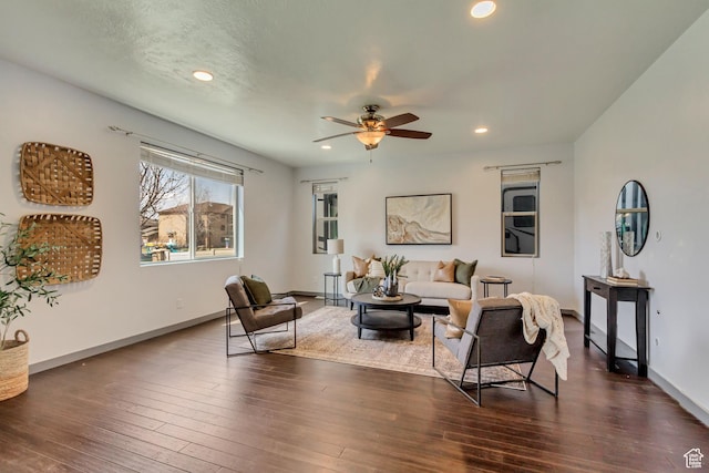 living area with recessed lighting, baseboards, a ceiling fan, and dark wood finished floors