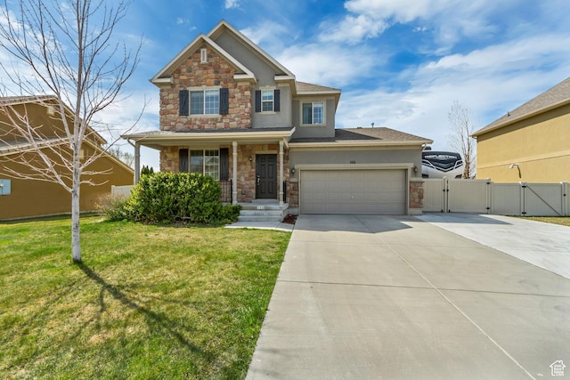 craftsman inspired home featuring driveway, stone siding, a front lawn, and a gate