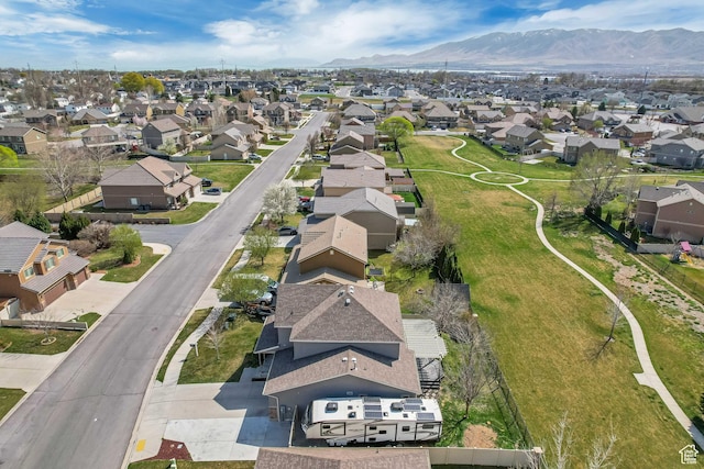 birds eye view of property with a residential view and a mountain view