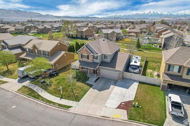 drone / aerial view featuring a mountain view and a residential view