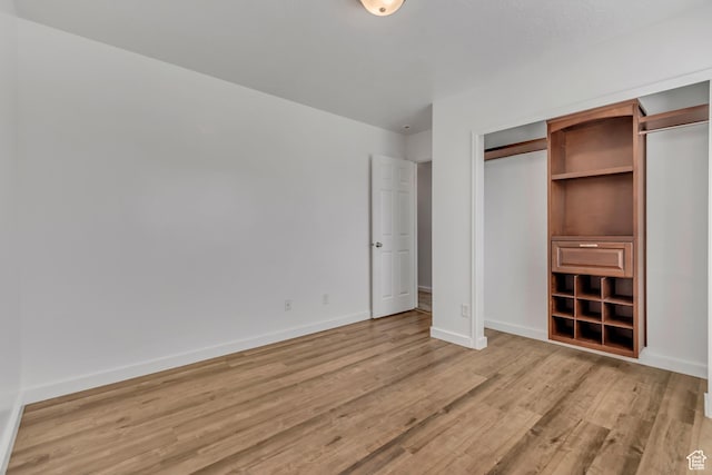 166 S 2035 W, Lehi, UT 84043 - unfurnished bedroom featuring light wood-style flooring, baseboards, and a closet