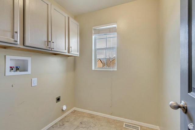 laundry area featuring hookup for a washing machine, electric dryer hookup, visible vents, baseboards, and cabinet space