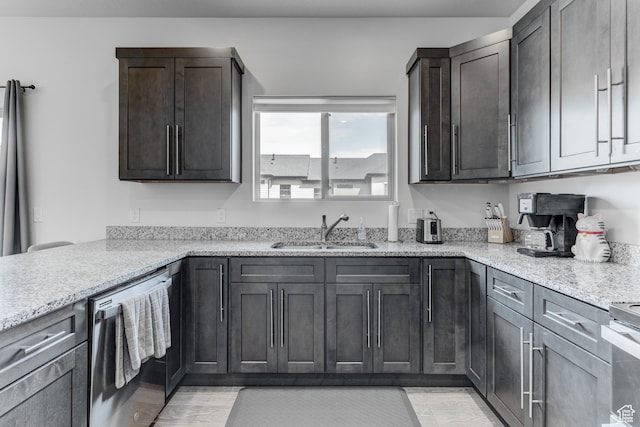 129 W Autumn Ln N, Saratoga Springs, UT 84045 - kitchen featuring a sink, stainless steel dishwasher, light stone counters, light wood finished floors, and dark brown cabinetry