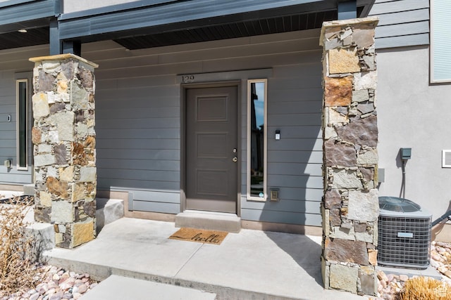 129 W Autumn Ln N, Saratoga Springs, UT 84045 - doorway to property with cooling unit and a porch