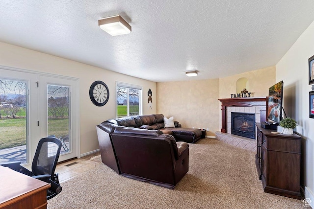 5716 W 4275 S, Hooper, UT 84315 - living area featuring a tile fireplace, light colored carpet, and a textured ceiling