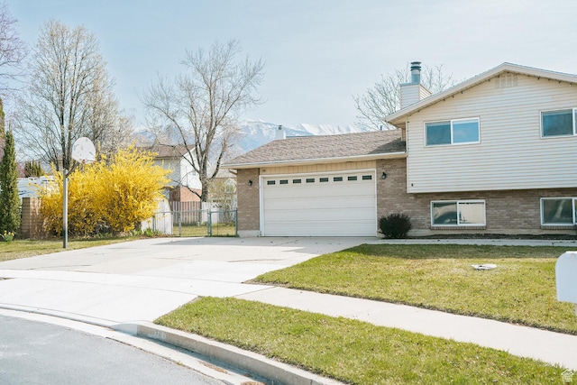 20 E 9n Cir N, American Fork, UT 84003 - view of front facade with brick siding, a front lawn, an attached garage, and driveway